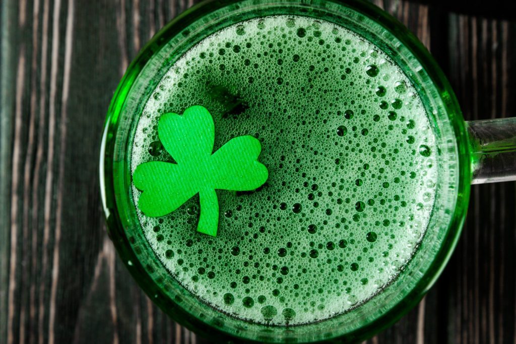 Happy St. Patrick's Day - green drink on wood desk