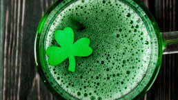 Happy St. Patrick's Day - green drink on wood desk