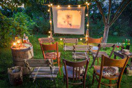 Summer cinema with retro projector in the garden - Beyond Storage