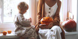 Family halloween activity pumpkin mother child