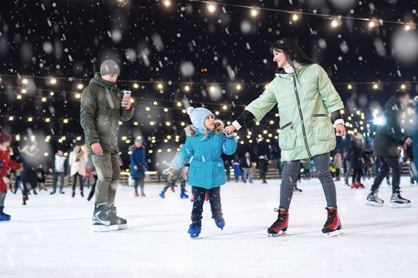 family ice skating Christmas time