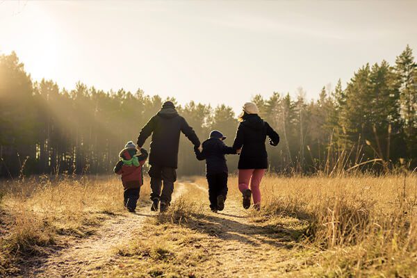 family enjoying winter walk